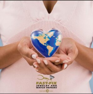 heart shape earth in womans hand